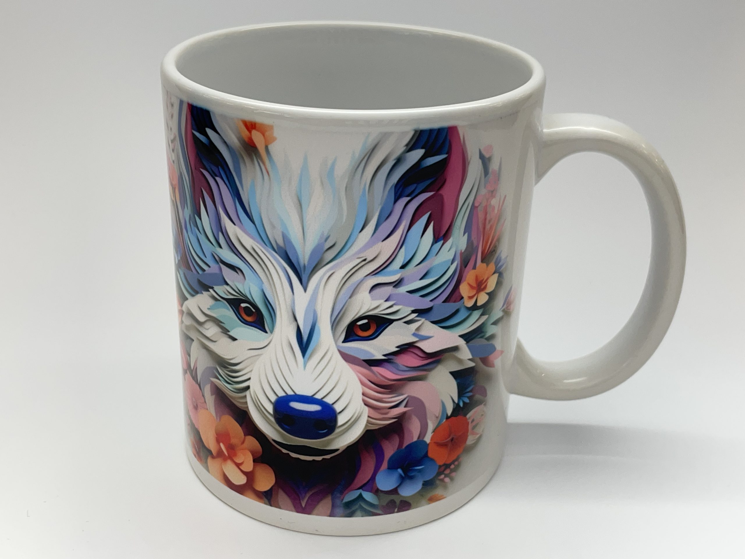 Coffee mug with a floral design and graphic design of an Alaskan Malamute face.