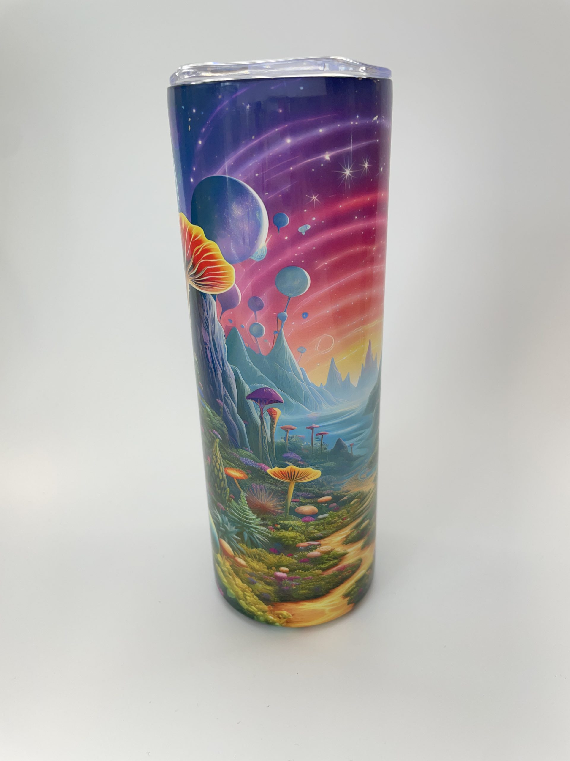 Tumbler with colorful science fiction themed graphic.